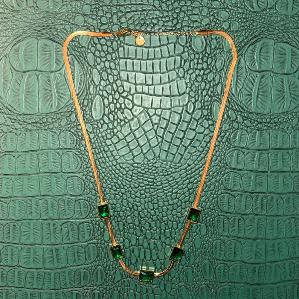 18KGP gold chevron necklace with five emerald green jewel stones